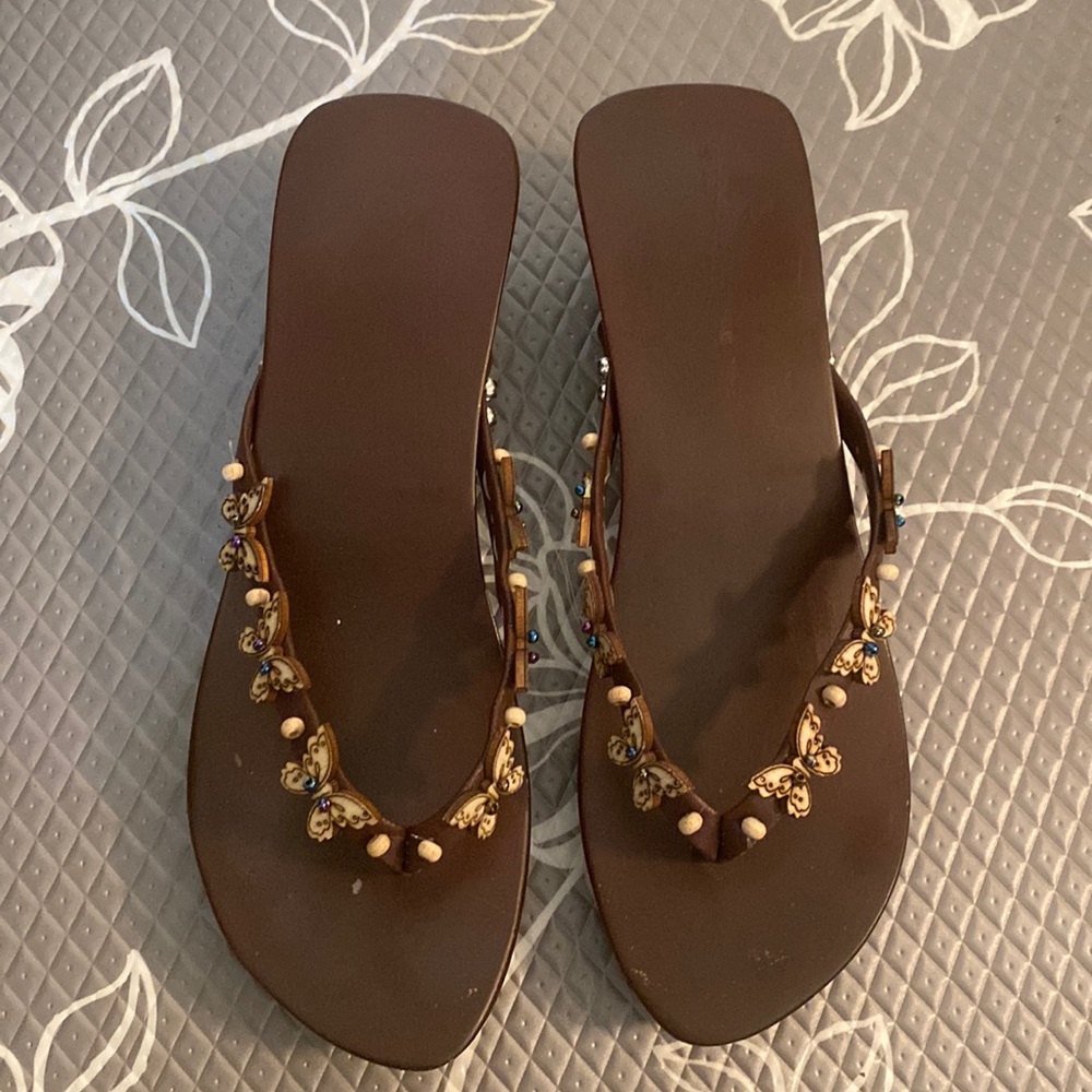 Wooden slipper bought in Japan with wooden butterflies decoration